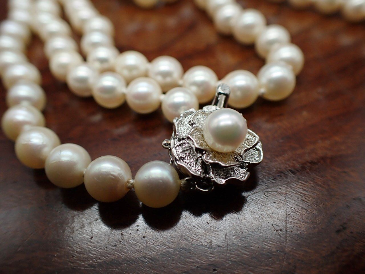 Yamato Akoya pearl necklace 160 cm length with silver clasp displayed on white background