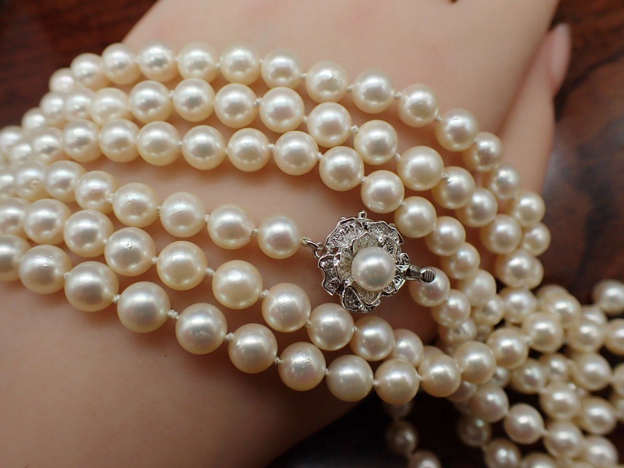 Yamato Akoya pearl necklace 160 cm length with silver clasp displayed on white background