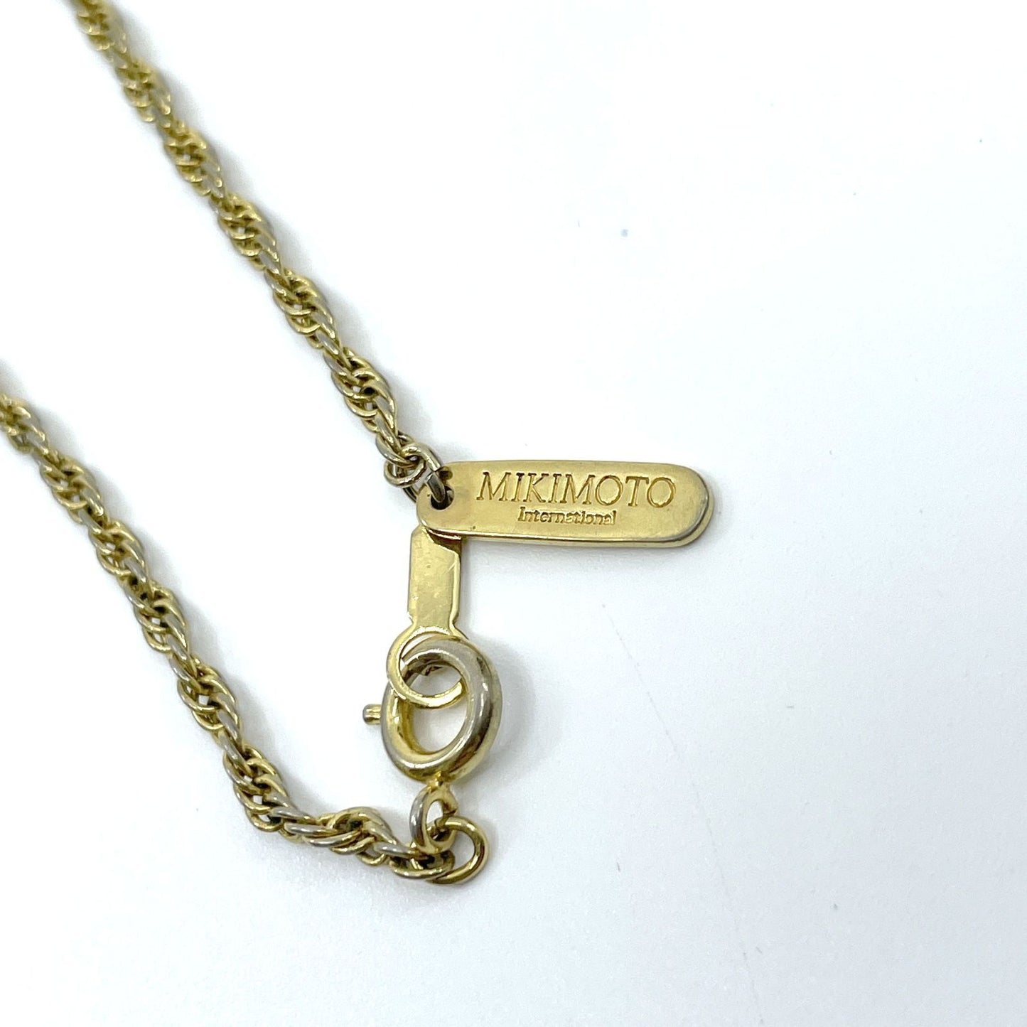 Mikimoto Loupe Pendant Necklace featuring a pearl magnifier on a 64 chain with moderate scratches