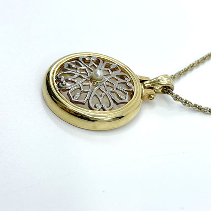 Mikimoto Loupe Pendant Necklace featuring a pearl magnifier on a 64 chain with moderate scratches