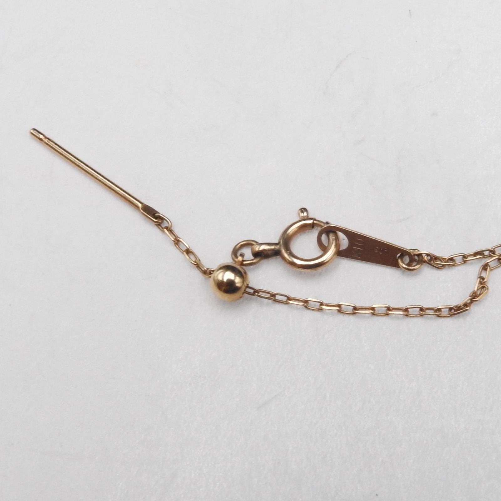 Agete pink gold necklace with 0.05ct diamonds featuring hollow moon and star motifs