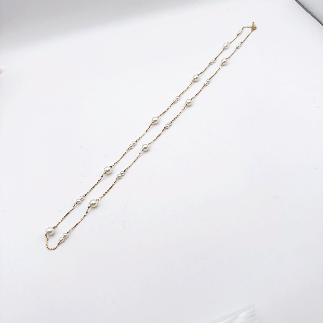 Mikimoto station pearl necklace with 3.7-6.4mm pearls on a 67cm K14 chain weighing 7.4g
