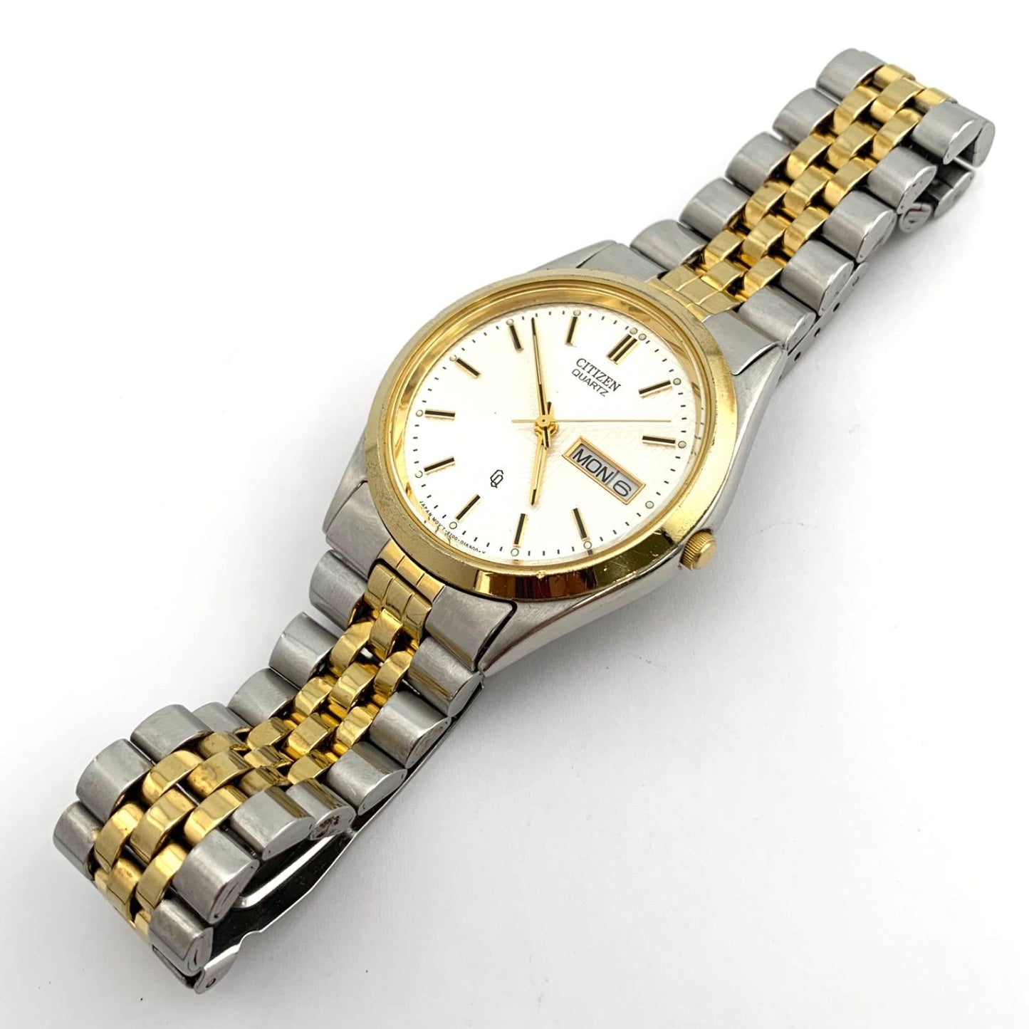 Used CITIZEN 6100 Quartz wristwatch in silver and gold with stainless steel band and date display
