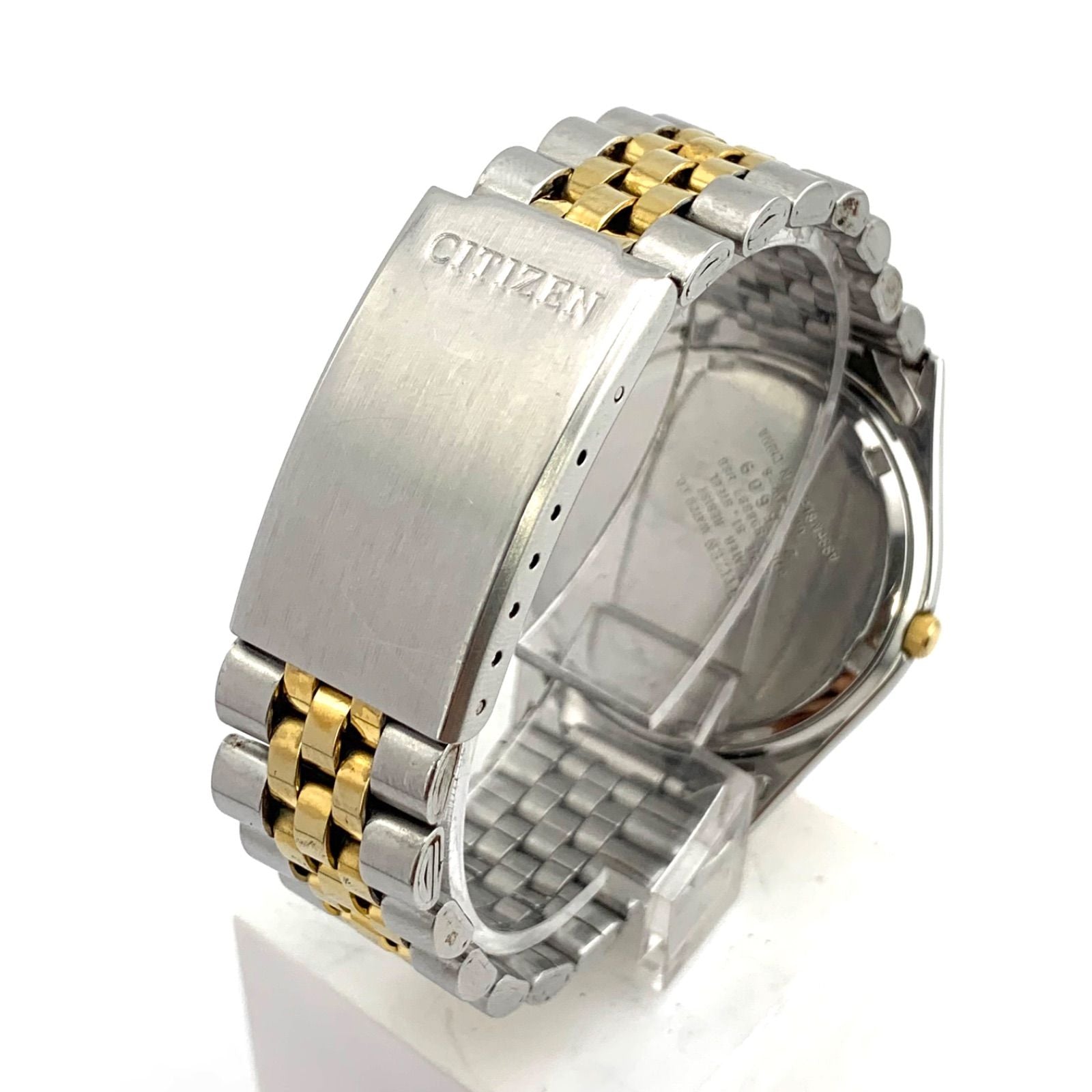 Used CITIZEN 6100 Quartz wristwatch in silver and gold with stainless steel band and date display