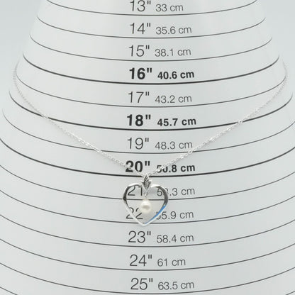 Mikimoto heart-shaped pearl necklace with silver chain displayed against white background