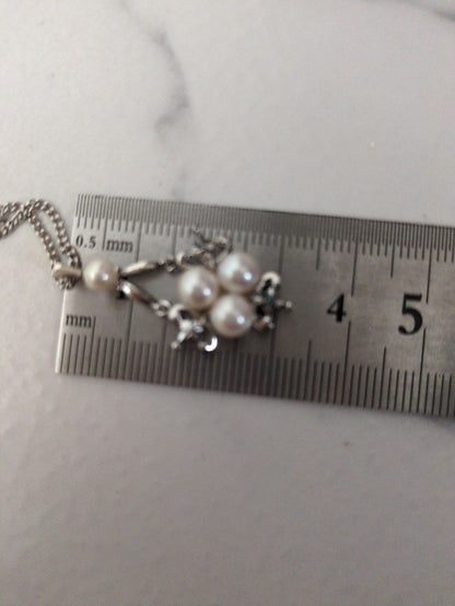 Close-up of a Mikimoto Pearl Necklace featuring lustrous genuine pearls on a delicate string