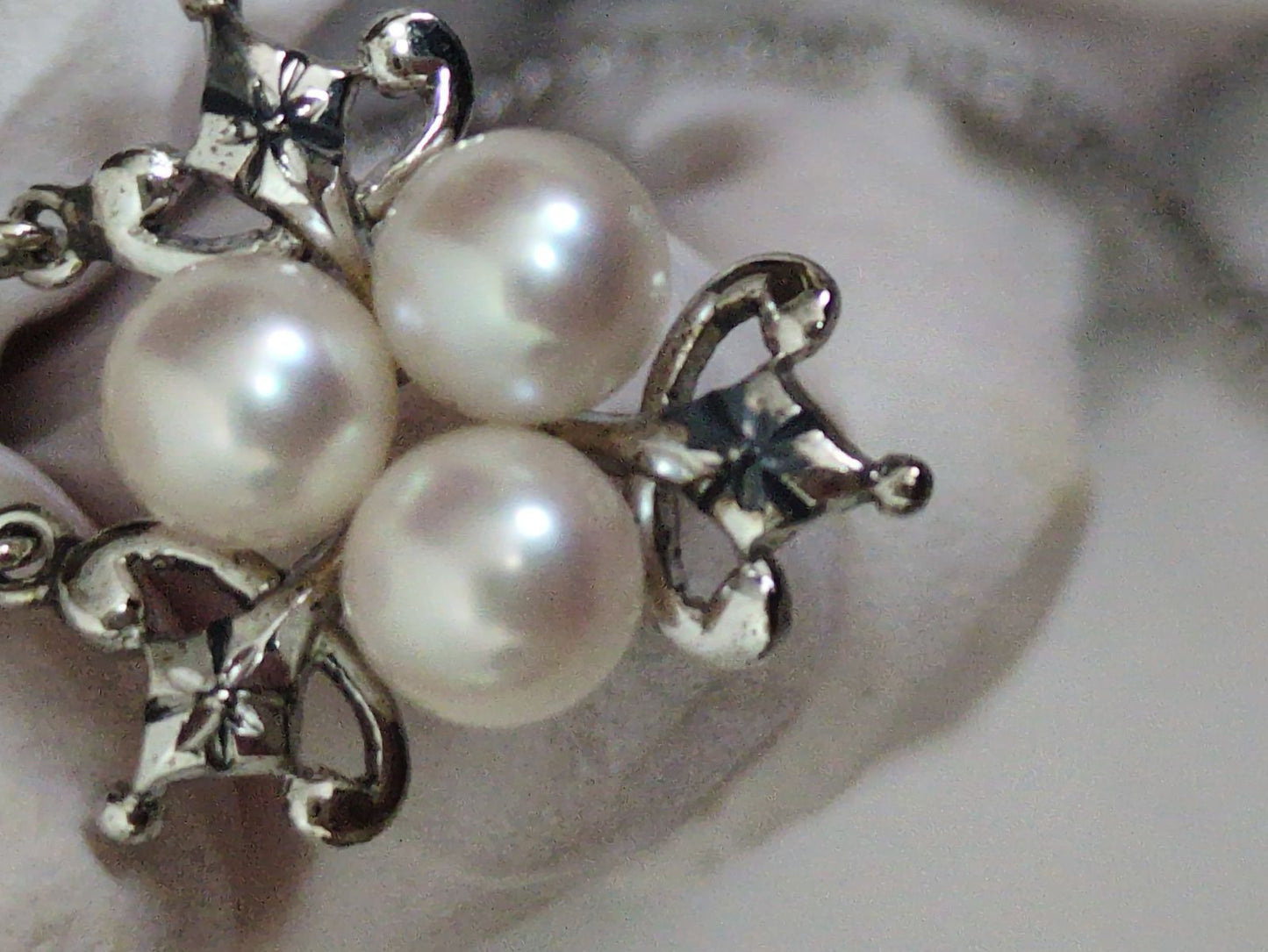 Close-up of a Mikimoto Pearl Necklace featuring lustrous genuine pearls on a delicate string