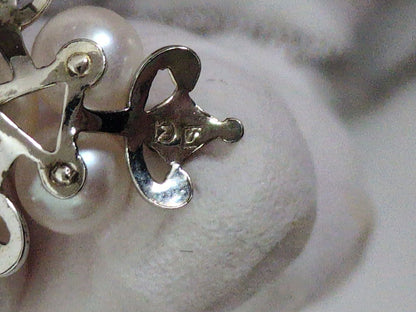 Close-up of a Mikimoto Pearl Necklace featuring lustrous genuine pearls on a delicate string