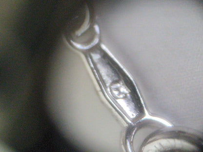 Close-up of a Mikimoto Pearl Necklace featuring lustrous genuine pearls on a delicate string