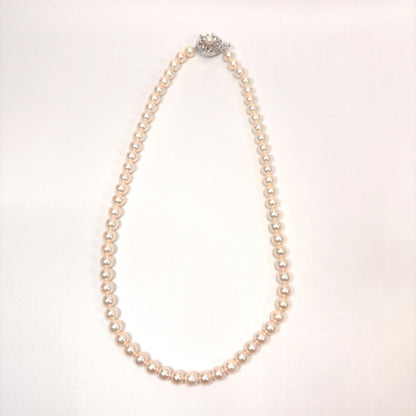 Akoya pearl necklace with 6mm real pearls and silver clasp displayed on a white background