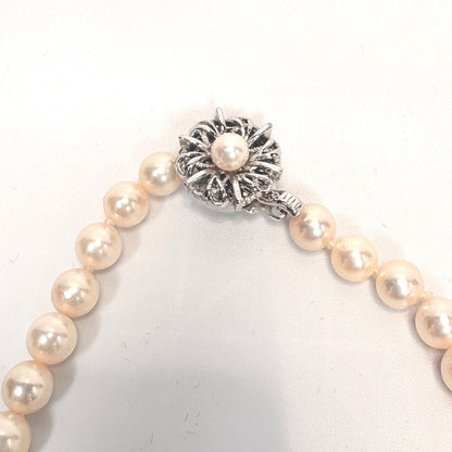 Akoya pearl necklace with 6mm real pearls and silver clasp displayed on a white background