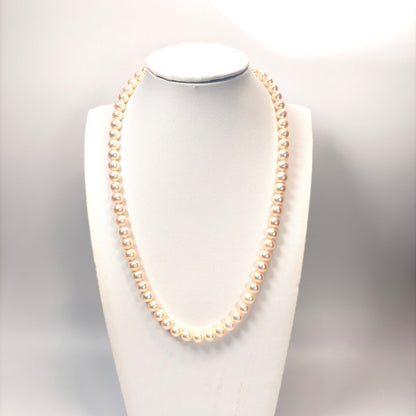 Akoya pearl necklace with 6mm real pearls and silver clasp displayed on a white background