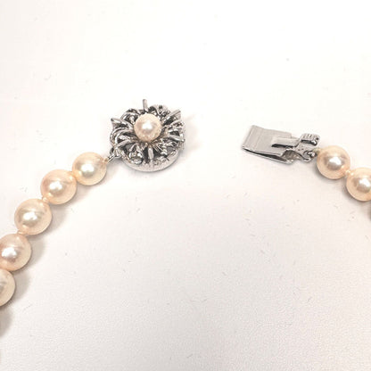Akoya pearl necklace with 6mm real pearls and silver clasp displayed on a white background