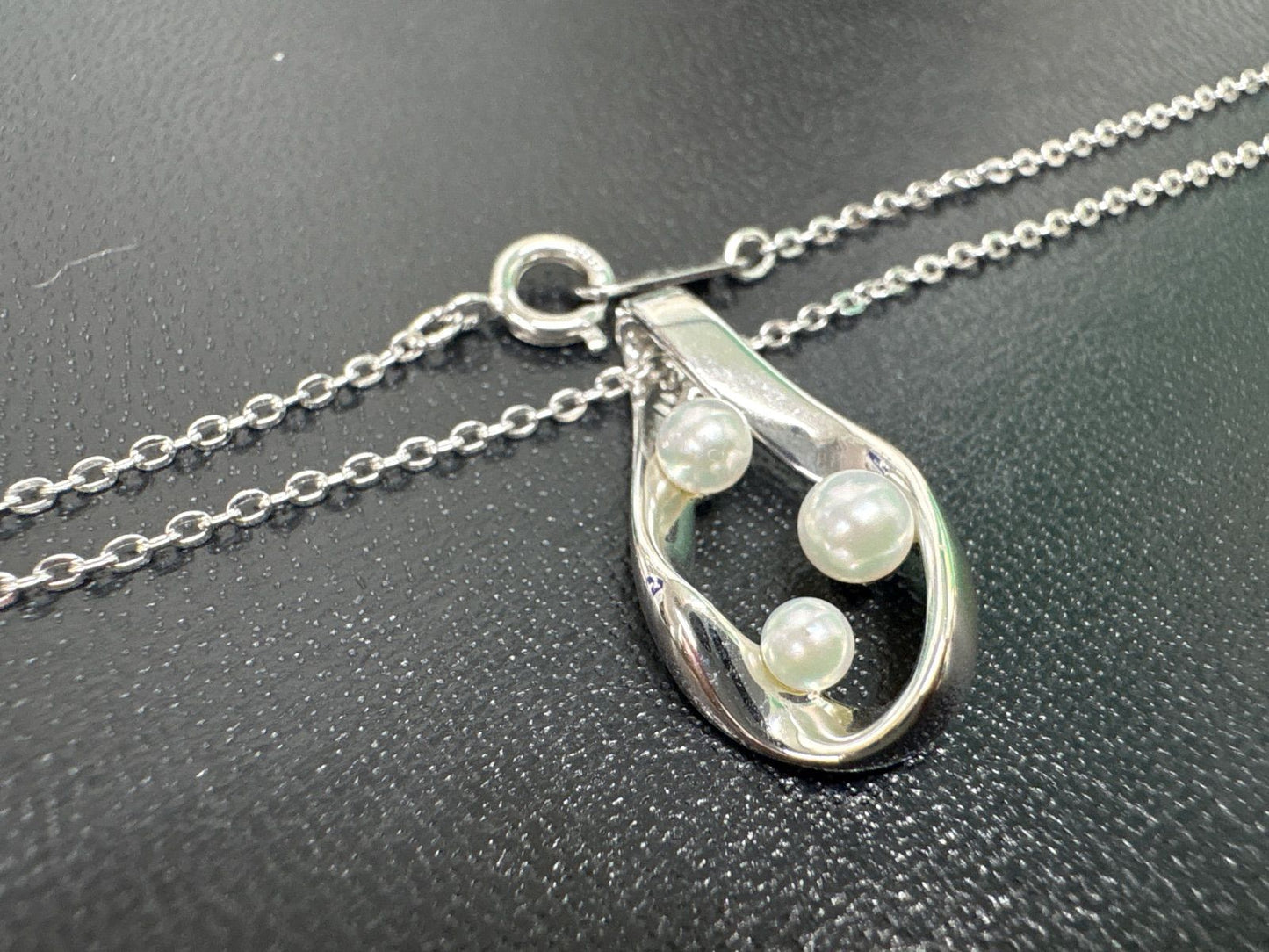 Mikimoto silver pearl necklace with 39.5cm length and sterling silver stamp shown on white background