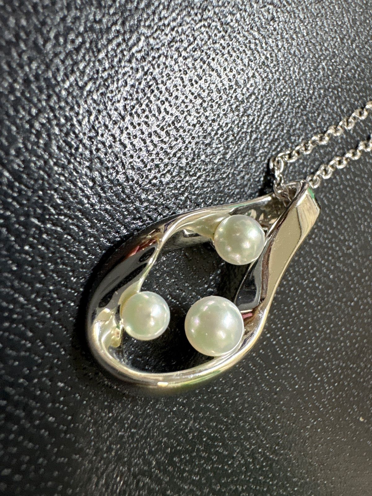 Mikimoto silver pearl necklace with 39.5cm length and sterling silver stamp shown on white background
