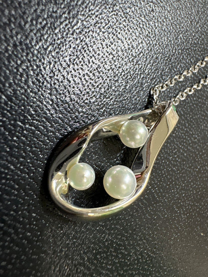 Mikimoto silver pearl necklace with 39.5cm length and sterling silver stamp shown on white background