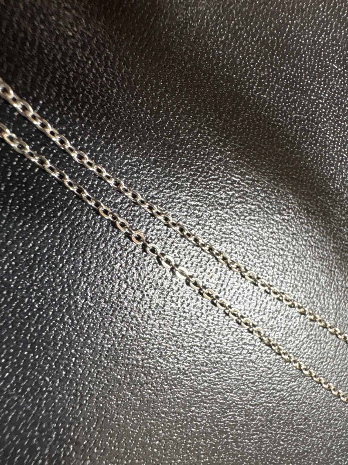 Mikimoto silver pearl necklace with 39.5cm length and sterling silver stamp shown on white background
