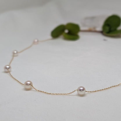 Akoya pearl necklace with white round pearls, 18k gold, 18 inches long