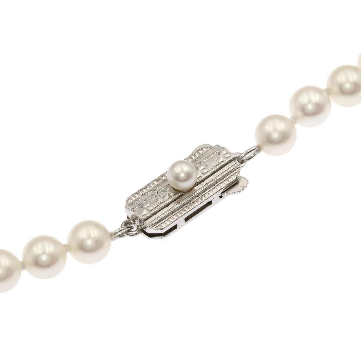 Mikimoto Pearl Necklace with 5.5-5.7 mm pearls and 36 cm silver chain displayed on white background
