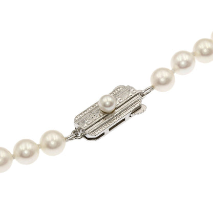 Mikimoto Pearl Necklace with 5.5-5.7 mm pearls and 36 cm silver chain displayed on white background