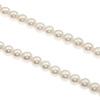Mikimoto Pearl Necklace with 5.5-5.7 mm pearls and 36 cm silver chain displayed on white background