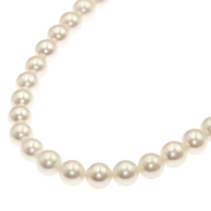 Mikimoto Pearl Necklace with 5.5-5.7 mm pearls and 36 cm silver chain displayed on white background