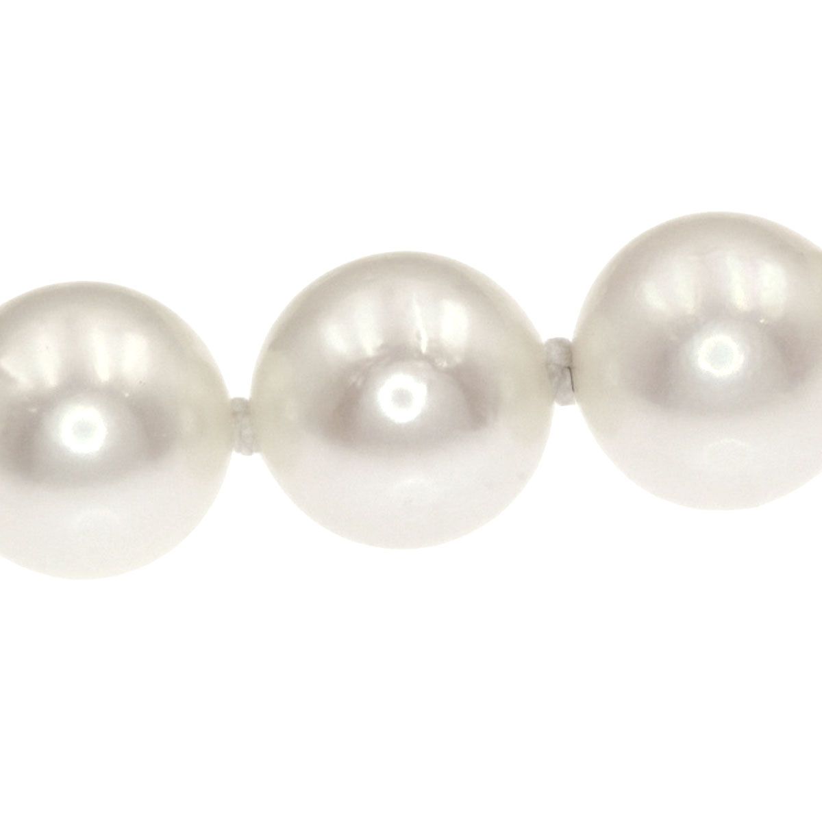 Mikimoto Pearl Necklace with 5.5-5.7 mm pearls and 36 cm silver chain displayed on white background