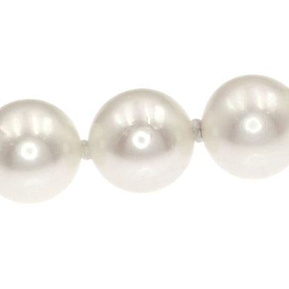 Mikimoto Pearl Necklace with 5.5-5.7 mm pearls and 36 cm silver chain displayed on white background