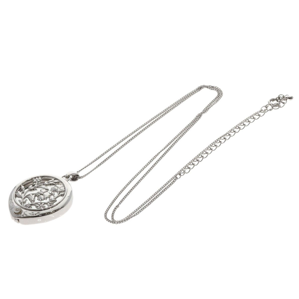 MIKIMOTO pearl necklace with metal chain and attached loupe, detailed close-up view