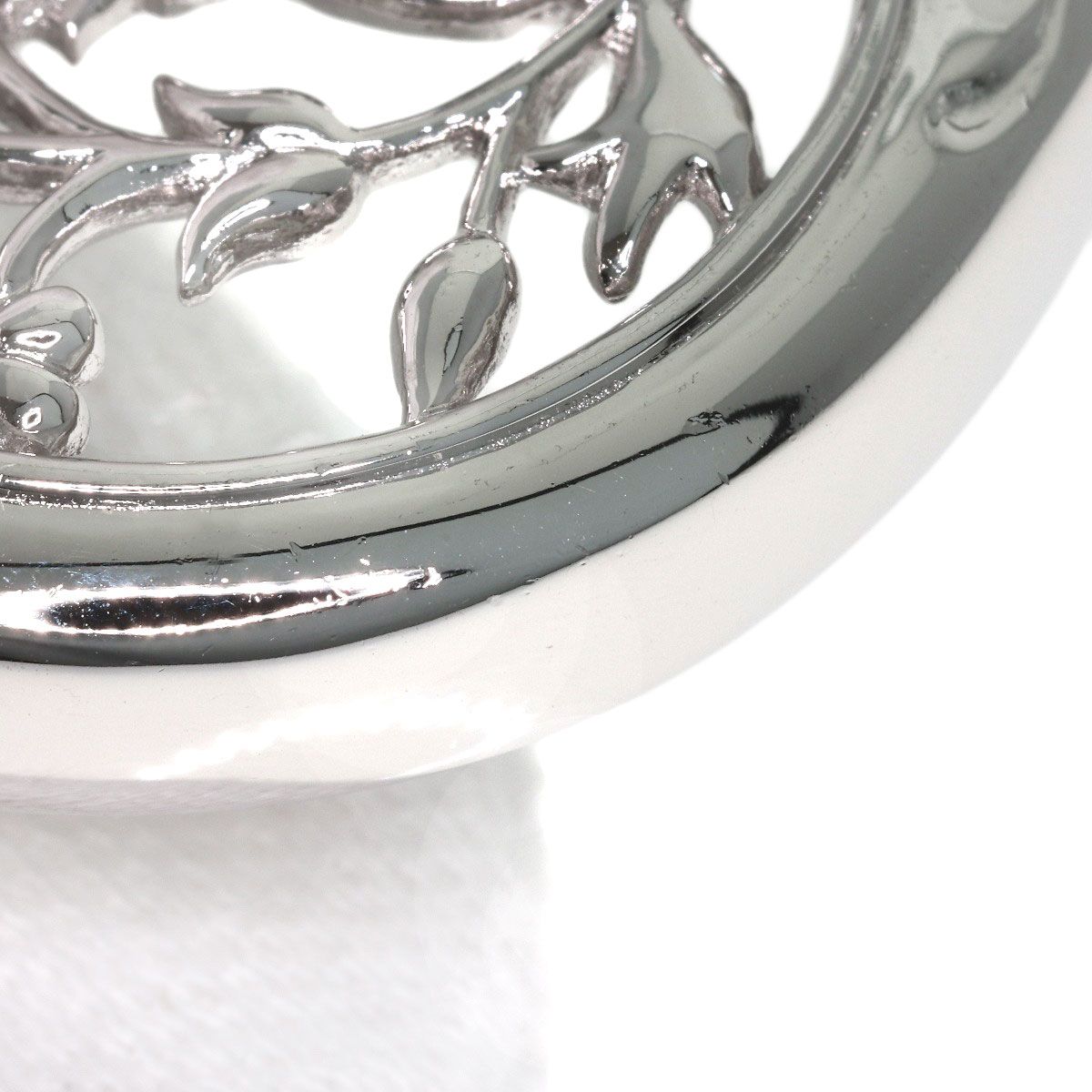 MIKIMOTO pearl necklace with metal chain and attached loupe, detailed close-up view