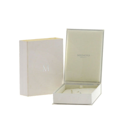 MIKIMOTO pearl necklace with metal chain and attached loupe, detailed close-up view