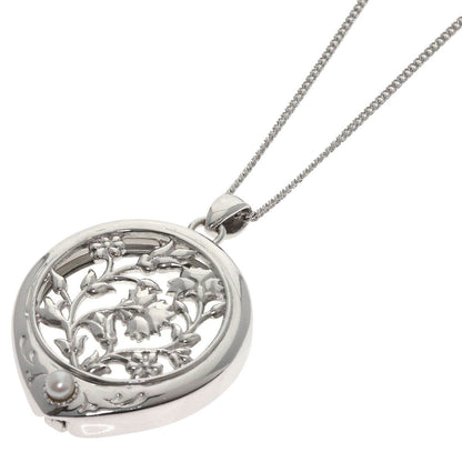 MIKIMOTO pearl necklace with metal chain and attached loupe, detailed close-up view