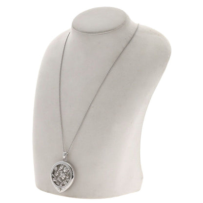 MIKIMOTO pearl necklace with metal chain and attached loupe, detailed close-up view