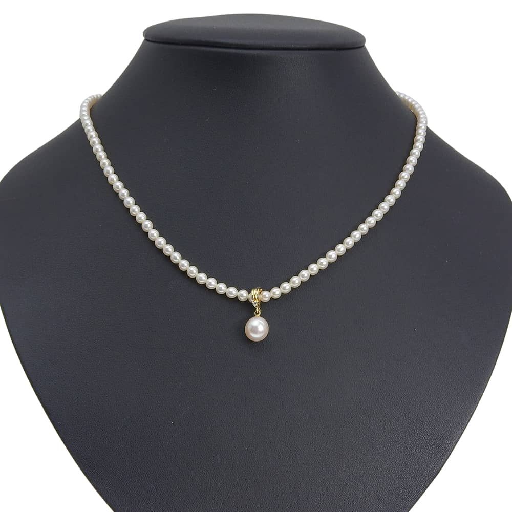 Tasaki pearl necklace with 18k yellow gold chain, freshwater Akoya pearls, and small melee diamonds