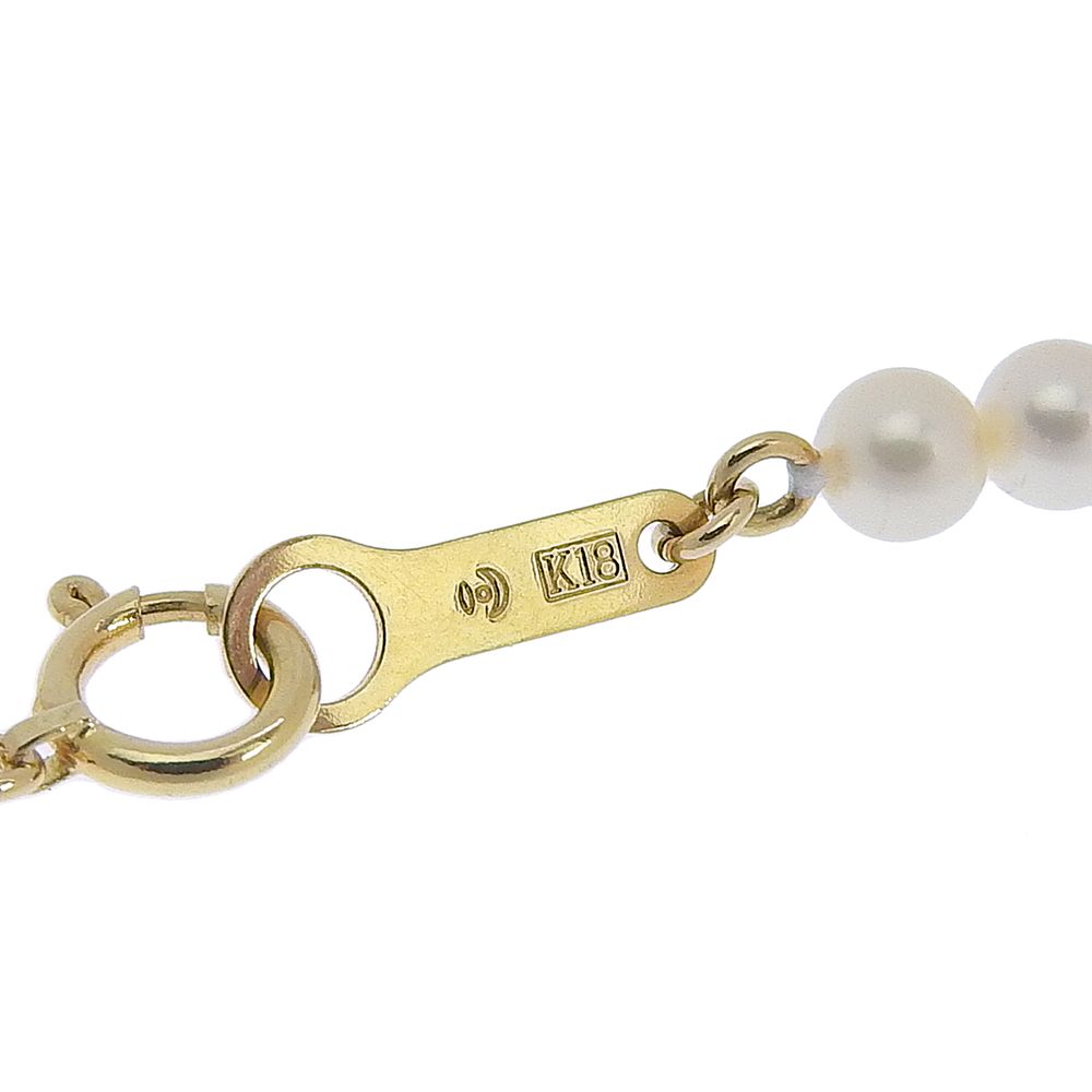 Tasaki pearl necklace with 18k yellow gold chain, freshwater Akoya pearls, and small melee diamonds