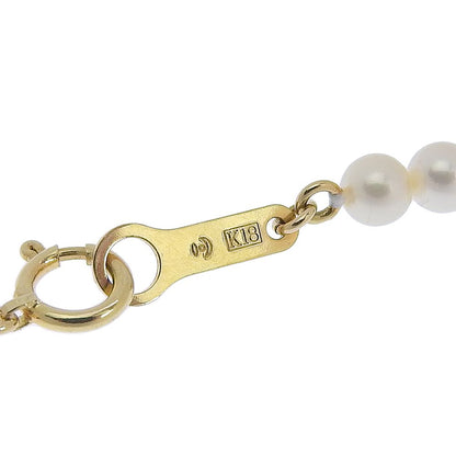 Tasaki pearl necklace with 18k yellow gold chain, freshwater Akoya pearls, and small melee diamonds