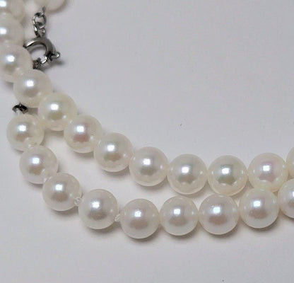 Akoya pearl necklace featuring round 5.5-6.0mm white, green, and pink pearls with good luster