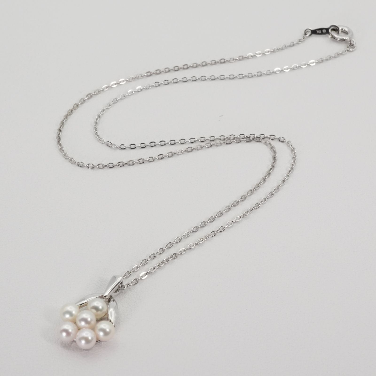 Mikimoto Baby Pearl Necklace with silver bouquet design, model 26-0321, shown on white background