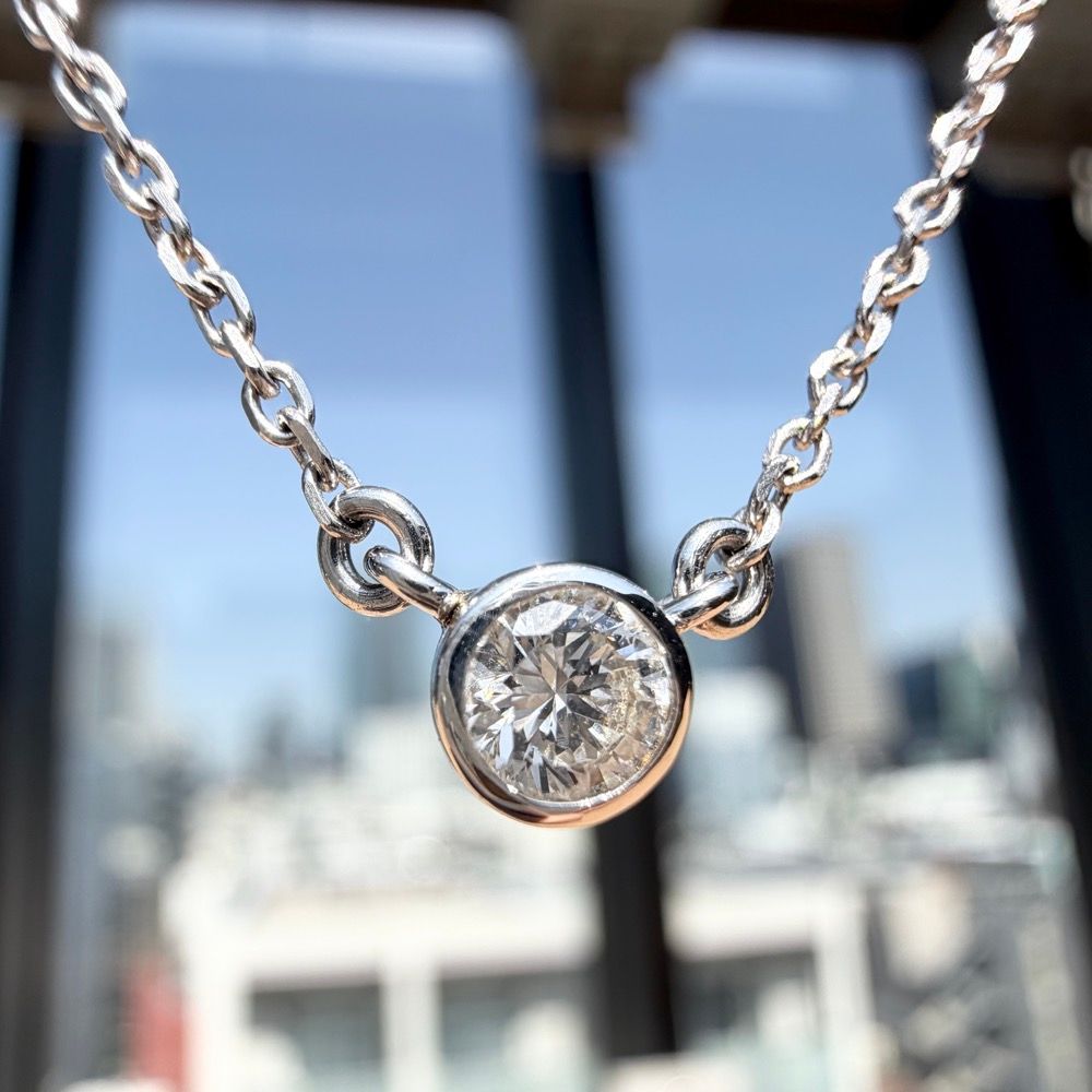 Mikimoto WGK14 0.20ct diamond necklace with 40cm chain displayed with necklace case