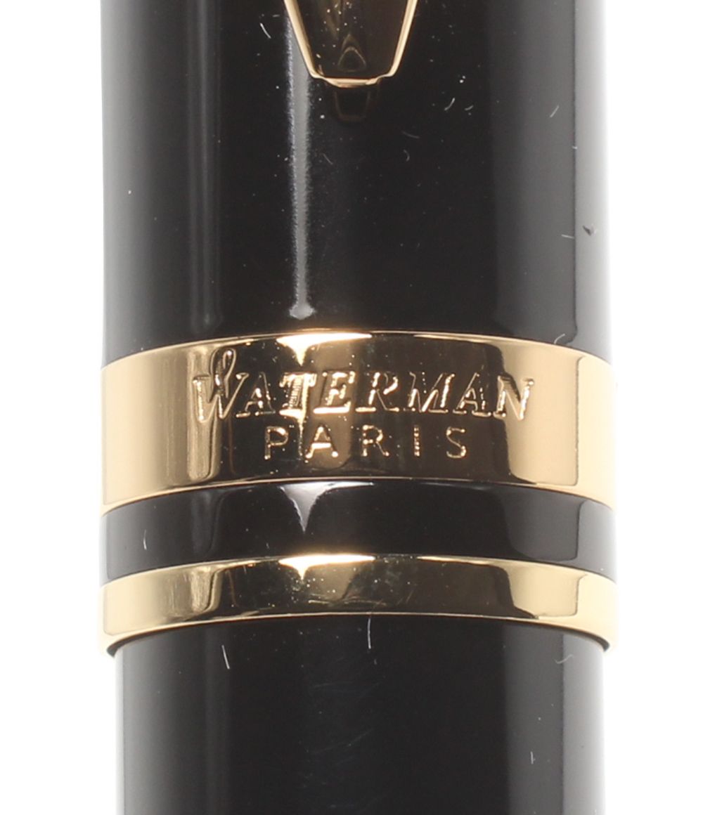 Waterman fountain pen converter measuring 14 cm for ink refilling with a clear body and blue piston mechanism