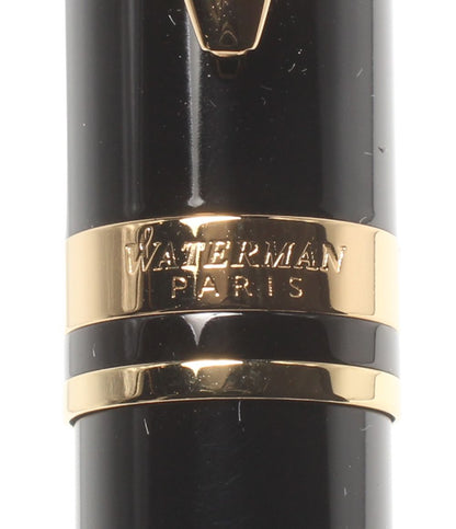 Waterman fountain pen converter measuring 14 cm for ink refilling with a clear body and blue piston mechanism