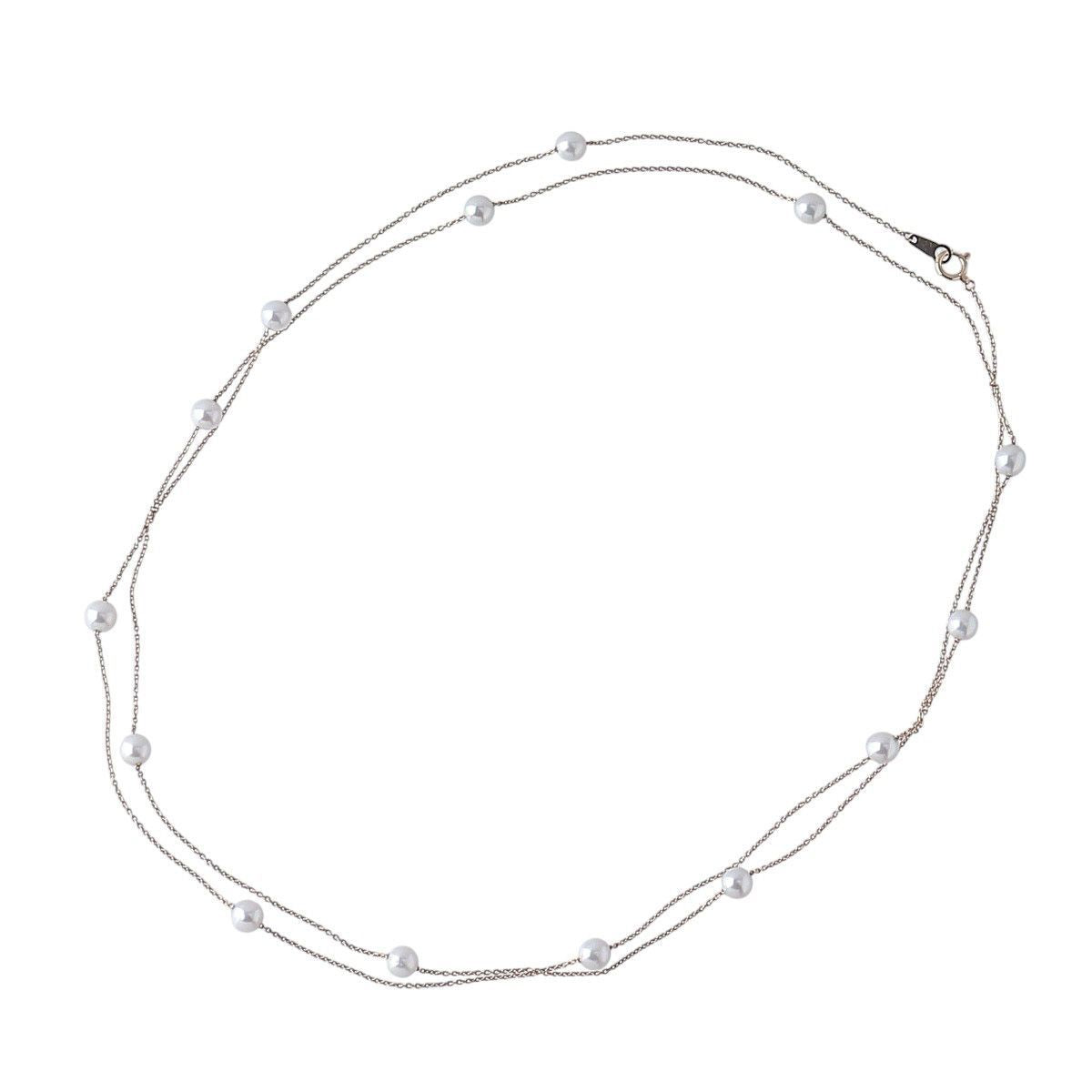 Tasaki long pearl necklace with 14 Akoya pearls sized 5.5 to 5.8mm on 18K yellow gold chain 100cm