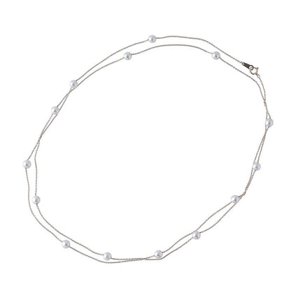 Tasaki long pearl necklace with 14 Akoya pearls sized 5.5 to 5.8mm on 18K yellow gold chain 100cm