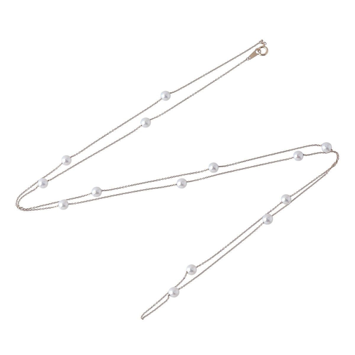 Tasaki long pearl necklace with 14 Akoya pearls sized 5.5 to 5.8mm on 18K yellow gold chain 100cm