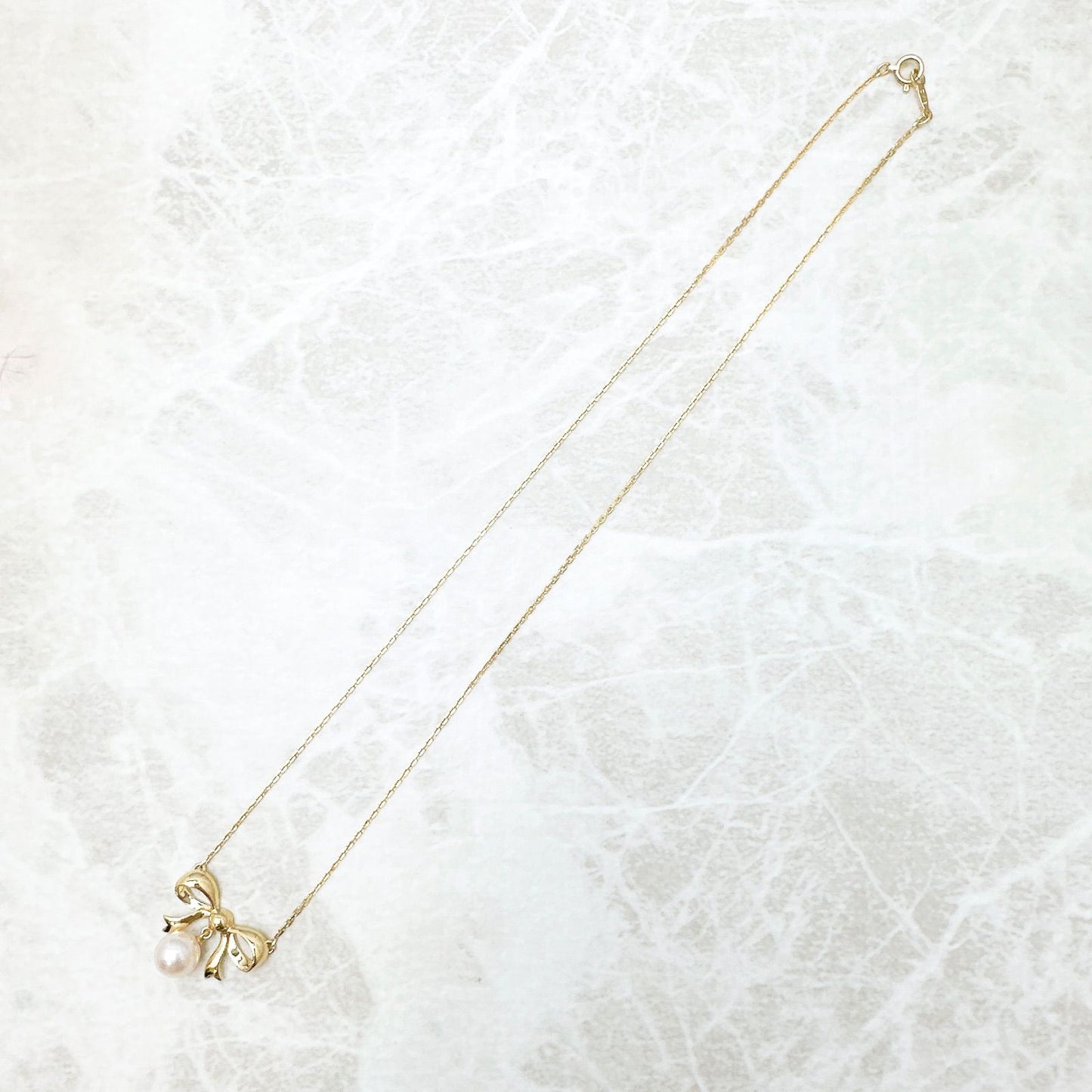 MIKIMOTO 7.2mm pearl necklace with yellow gold ribbon pendant, approximately 40cm length