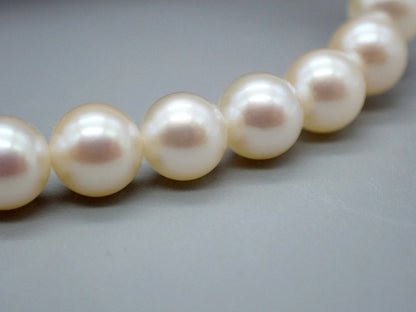 MIKIMOTO Akoya Pearl Necklace with 5.5mm pearls, 38cm length, displayed with original case