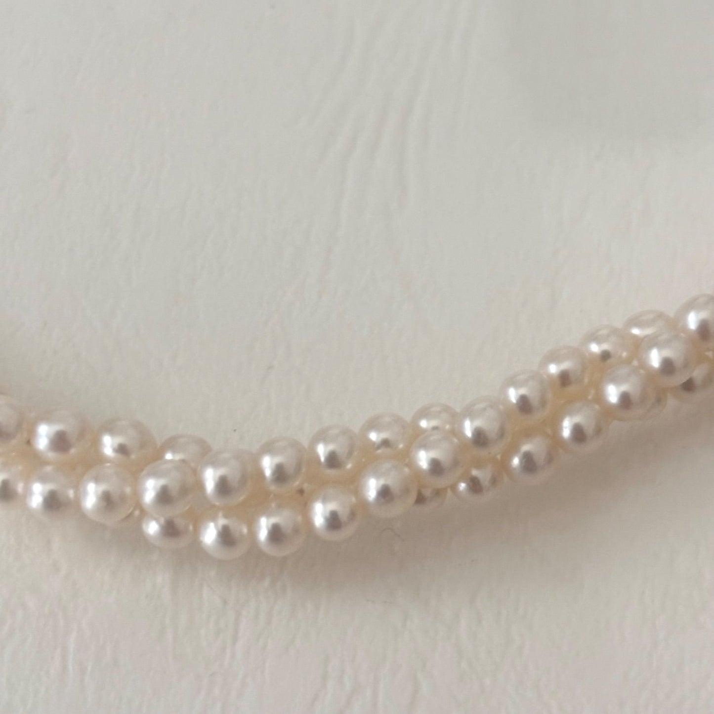 188 Tasaki silver three-row necklace featuring baby pearls and a ribbon clasp, 42.5 cm length