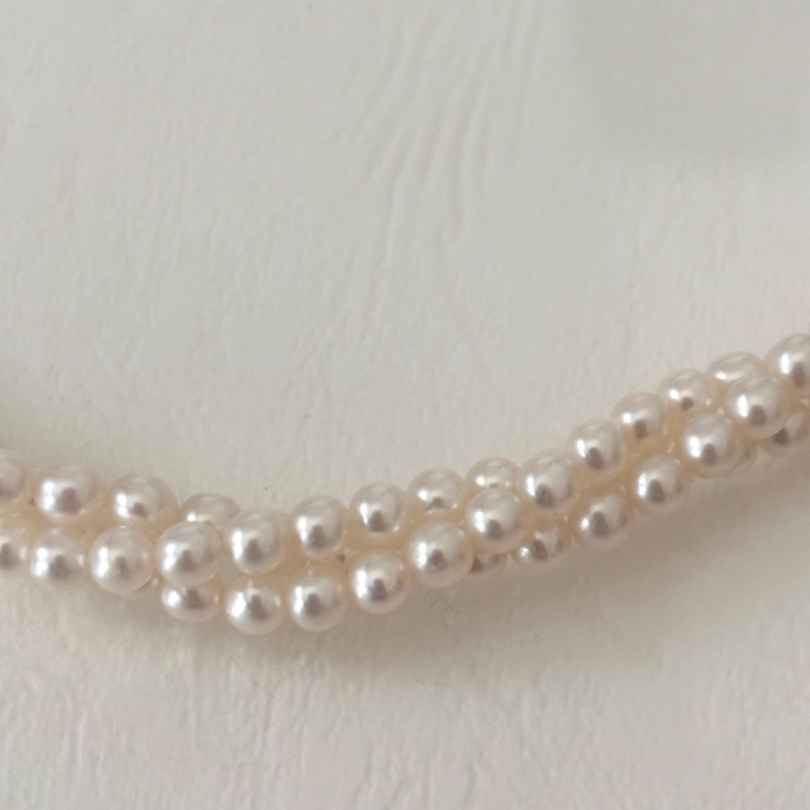 188 Tasaki silver three-row necklace featuring baby pearls and a ribbon clasp, 42.5 cm length