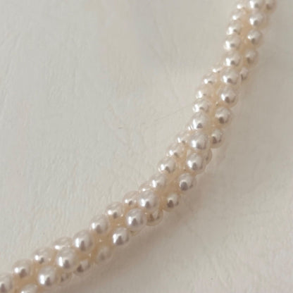 188 Tasaki silver three-row necklace featuring baby pearls and a ribbon clasp, 42.5 cm length