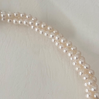 188 Tasaki silver three-row necklace featuring baby pearls and a ribbon clasp, 42.5 cm length